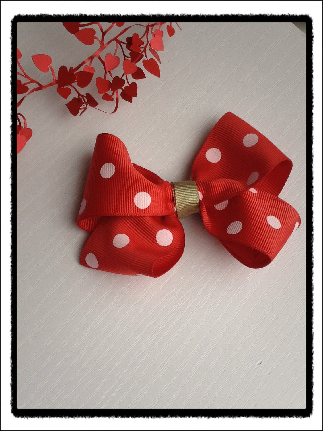 Red and white polka dots bow