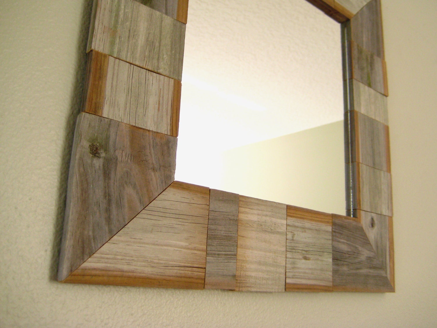 mirror in a handmade fence slat frame