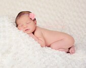 Mini Coral Flower with a pink glass pearl center on a lavender skinny band, perfect for newborns and photo shoots