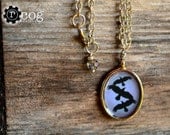 Divergent  Jewelry: Silver-tone, 3 Crows Fly over a Periwinkle Sky.