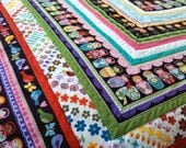 Bright and cheery Russian Matryoshka doll baby quilt- made to order