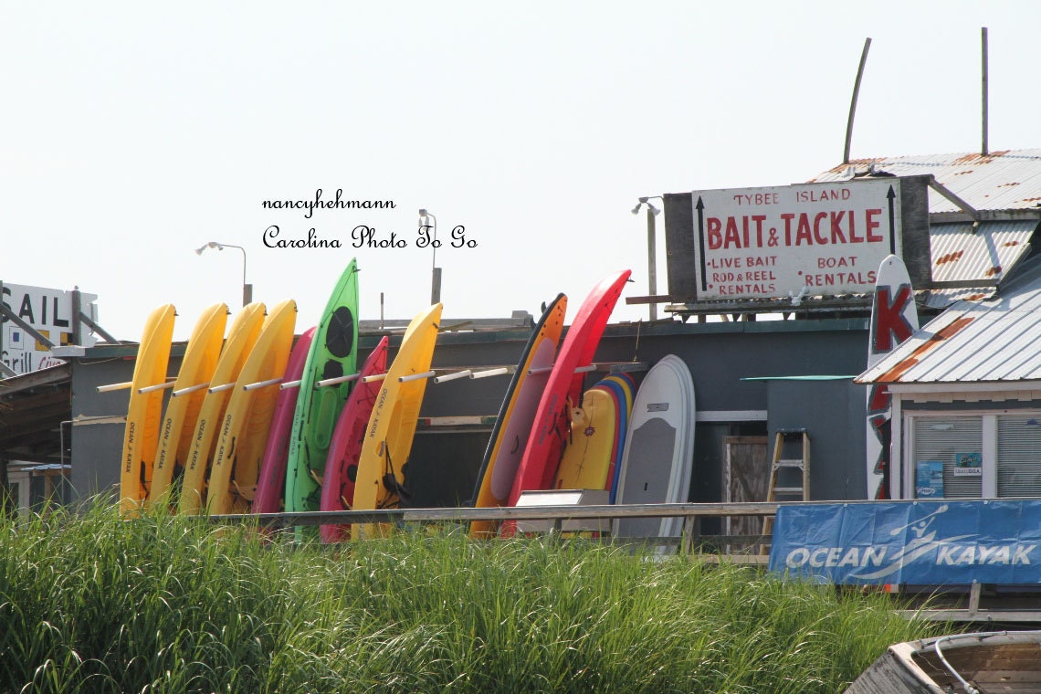 Beach shop with brightly colored kayaks on Tybee Island Georgia. Coastal or beach deor.