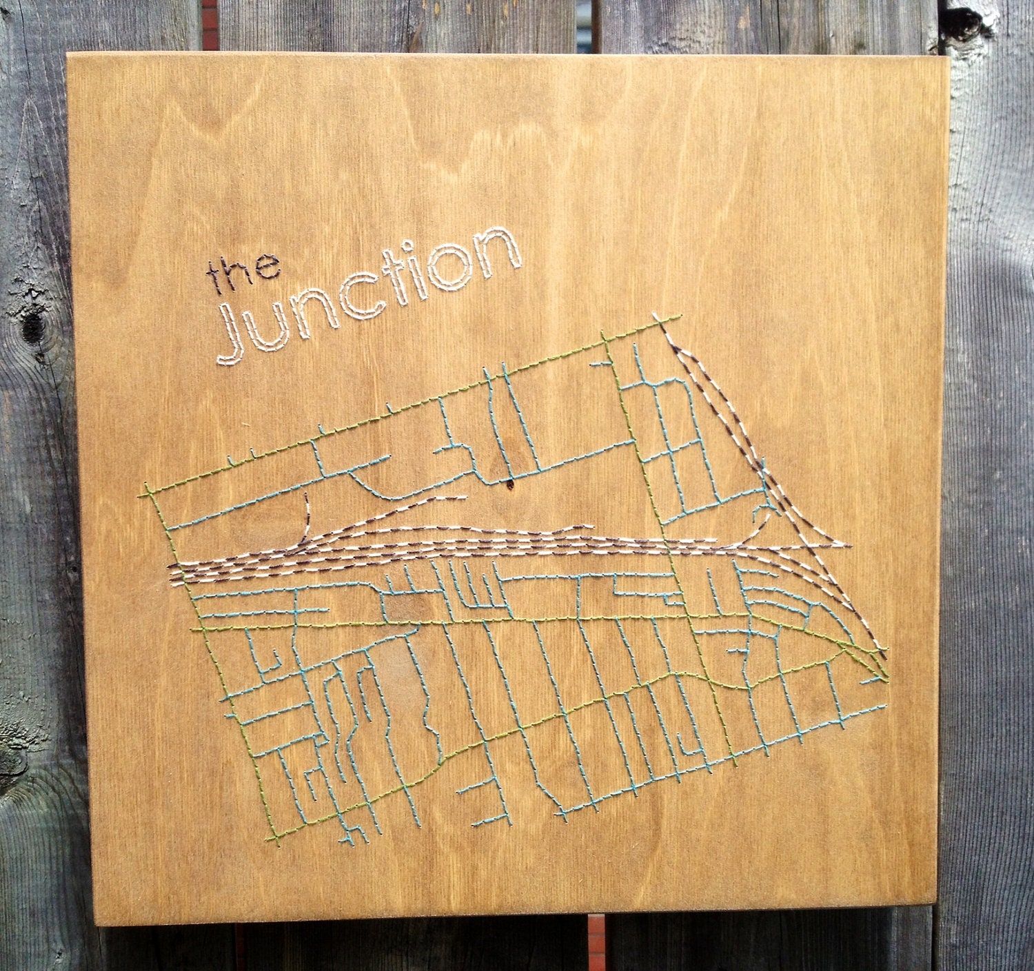 Neighbourhood map embroidered in wood