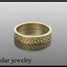 For her 14k gold special design Wedding Band.