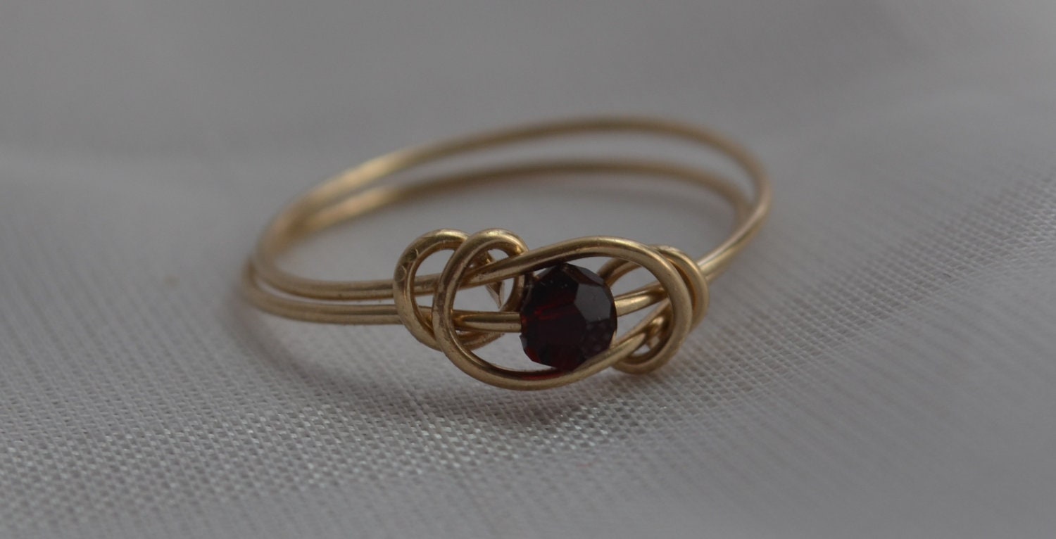 Garnet love knot ring 14 Karat gold filled wire with Swarovski crystal January birthstone Jewelry made to order