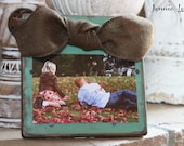 Teal Distressed Wooden Frame with a Brown Burlap Bow