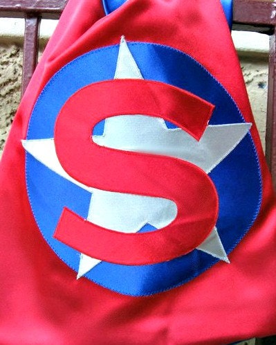 Reversible satin superhero cape in your choice of colors with a circle and star emblem and custom initial