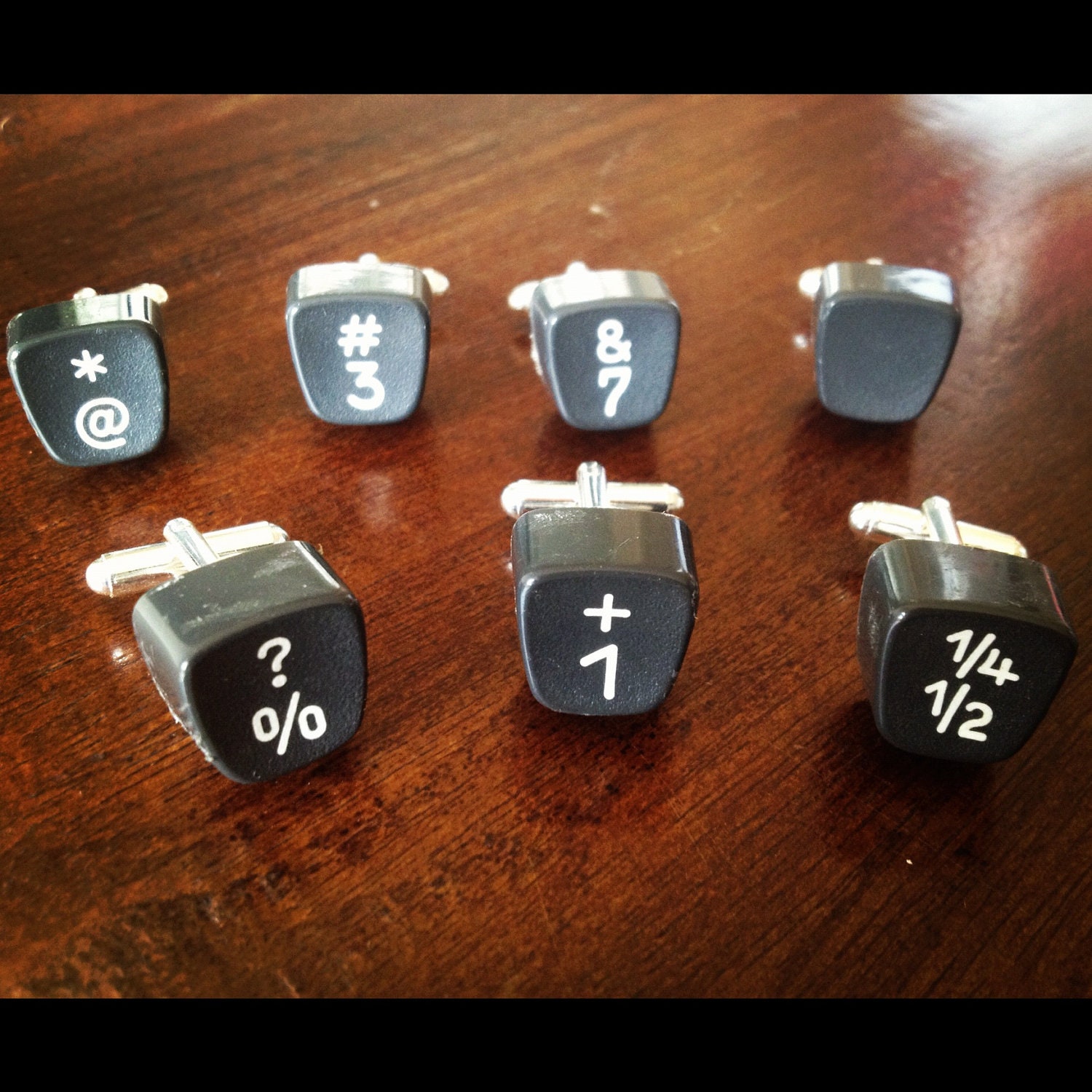 Men's cufflinks (numbers) crafted from an original 1955 Olympia typewriter.