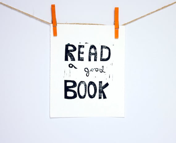 Typography print of Read a Good Book Linocut in black 8x10 on white paper