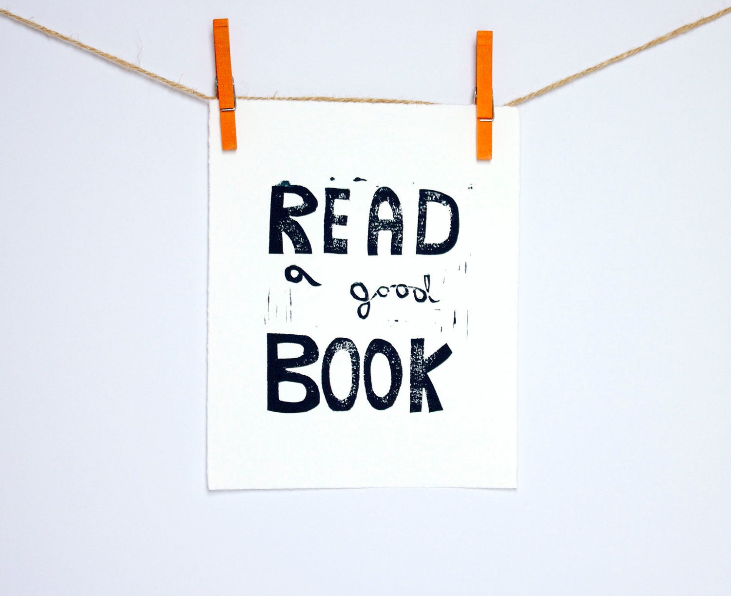 Typography print of Read a Good Book Linocut in black 8x10 on white paper