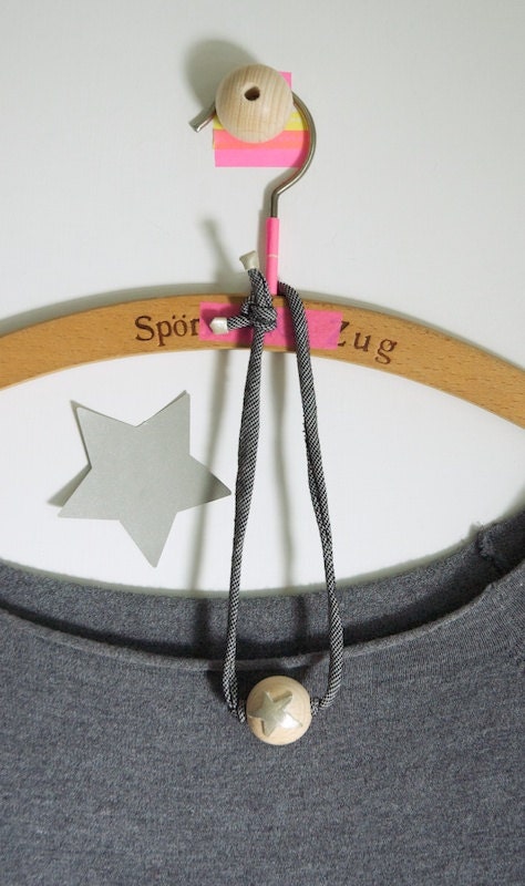 Necklace - wood bead and jersey yarn. Decorated with leather light gold shapes