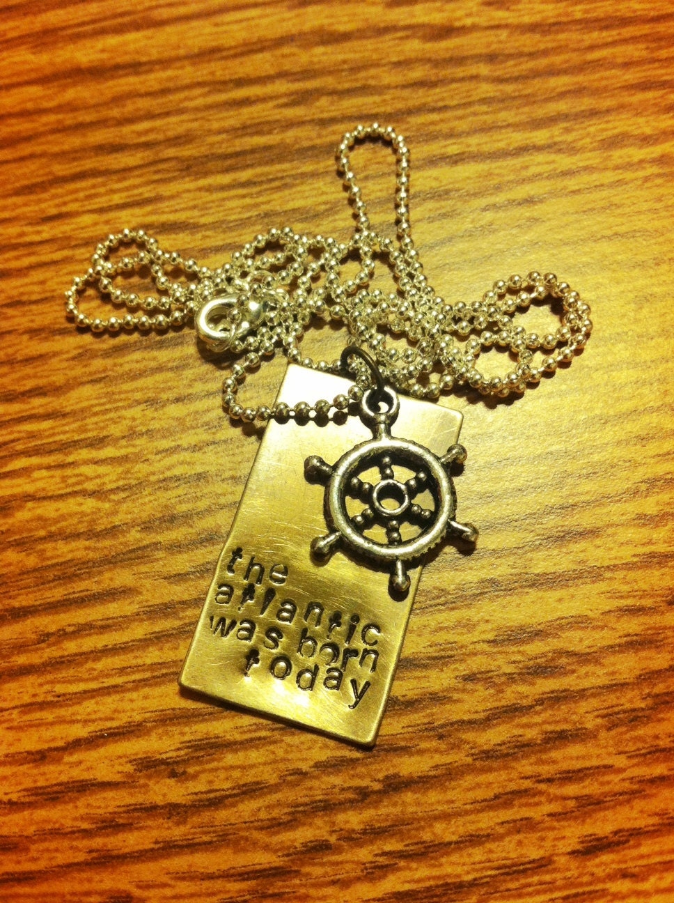hand stamped "the atlantic was born today" death cab for cutie song lyrics antique brass necklace with silver heart charm