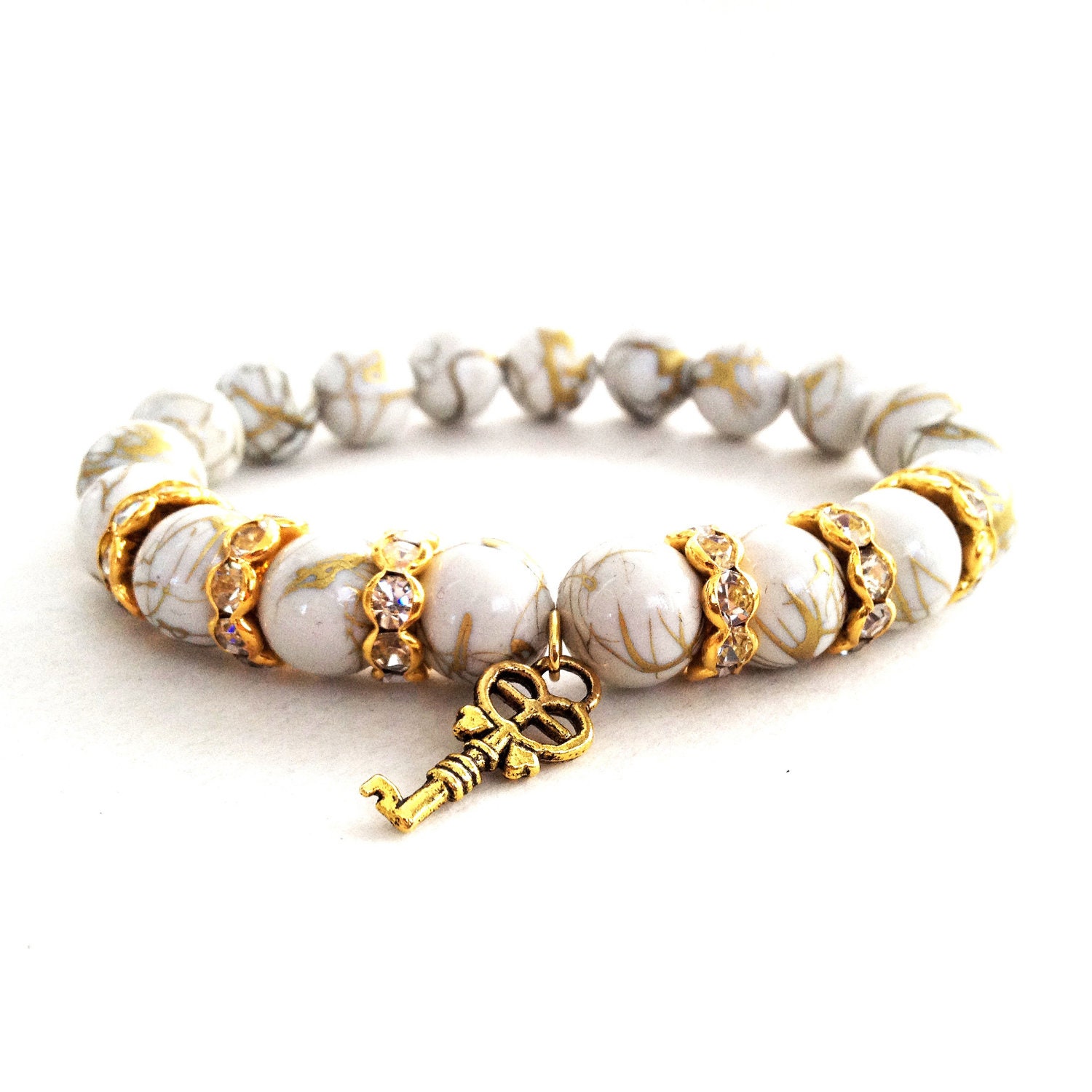 Gold Drizzled White Arm Candy Beaded Bracelet with Crystal Rondelles & Lucky Key Charm