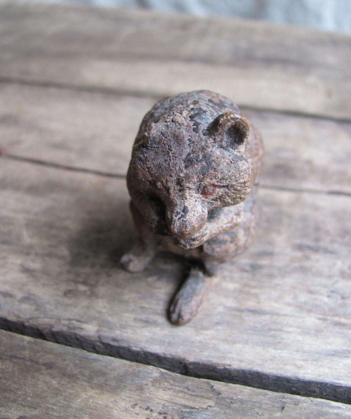 SALE // antique rabid raccoon figurine with beady red eyes