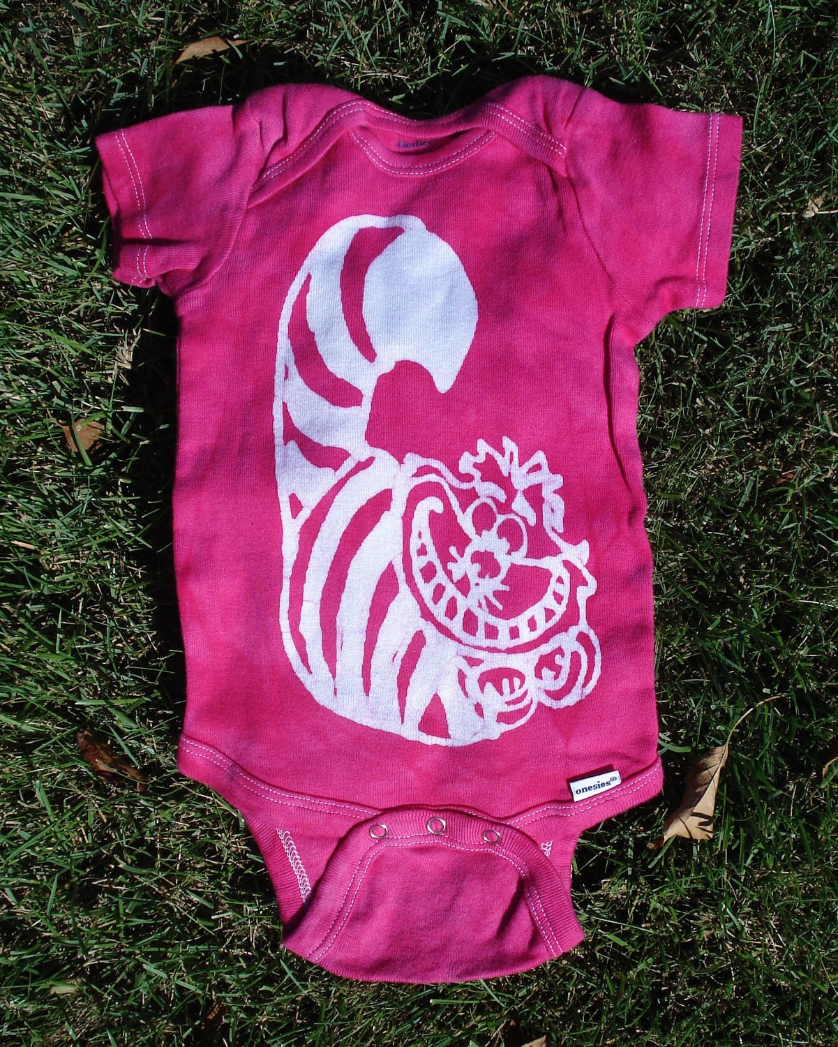 Cheshire Cat Alice In Wonderland Baby Batik Onesie by AppleJaxie