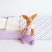 Lilac felt bunny in matchbox bed