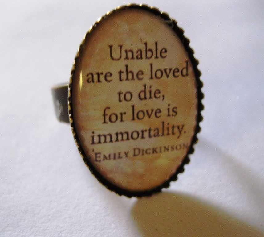 Unable are the loved to die.... .Emily Dickinson quote in brass oval shaped ring base