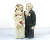 Bride and groom wedding cake topper