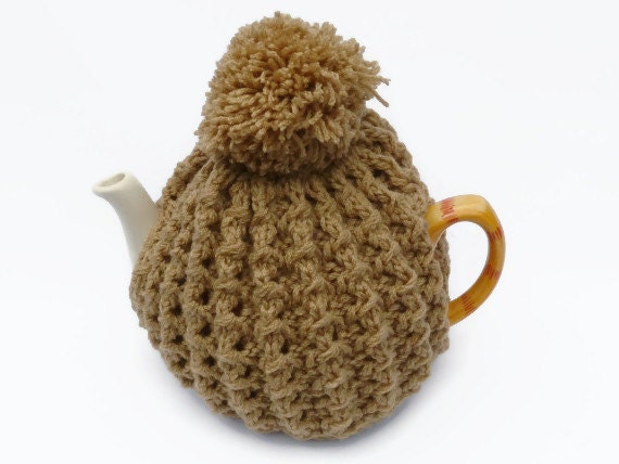 tea cosy cosie cozy light brown  with pom pom