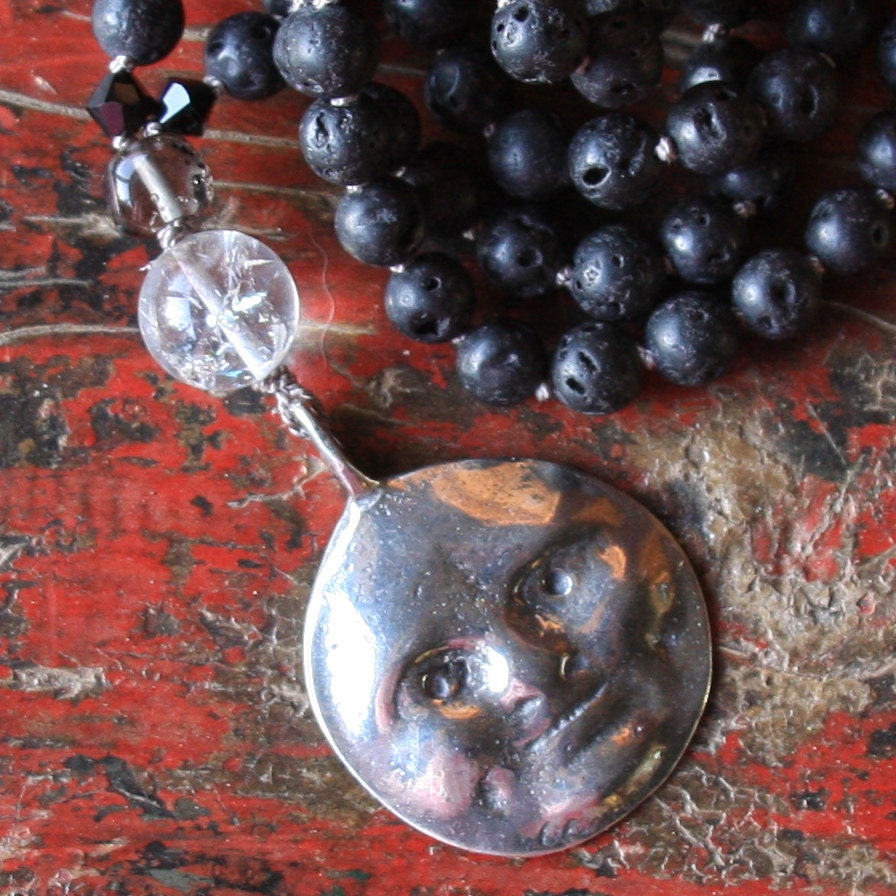 SALE.....moon face pendant long black necklace.....