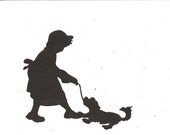 Little girl playing with dog silhouette