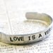 Bracelet Hand Stamped Love Is A Verb Cuff Aluminum Can Be Personalized With Your Own Words