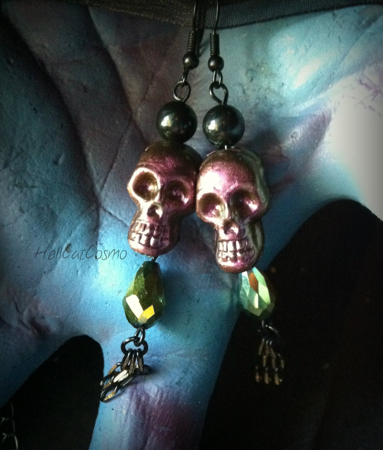 Junebug color shifting skull earrings