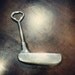 Putter golf club bottle opener
