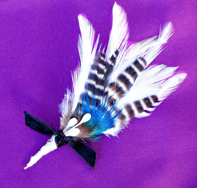 Men's Wedding Boutonniere with stunning white feathers, dark striped feathers and accented with a peacock tip feather