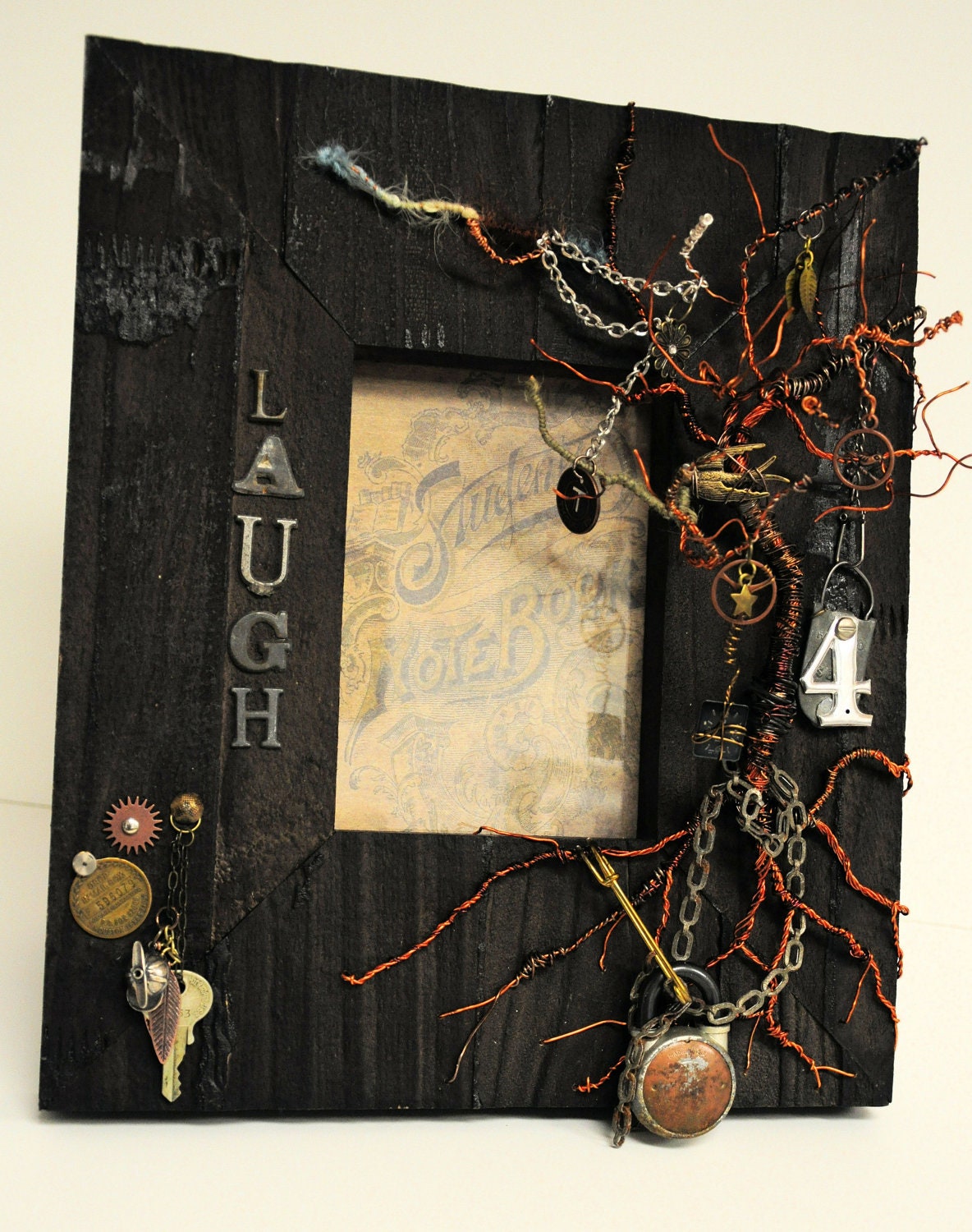 Steampunk copper wire tree mounted on rustic wood frame with found objects holds a 5 x 7 print