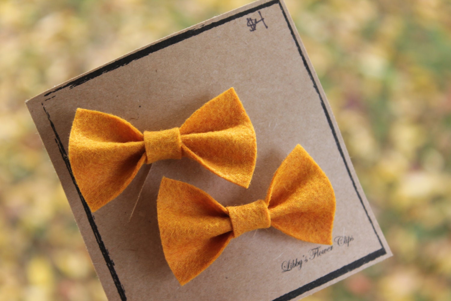 Set of two small wool felt bows in Butternut Squash Yellow - lbratt