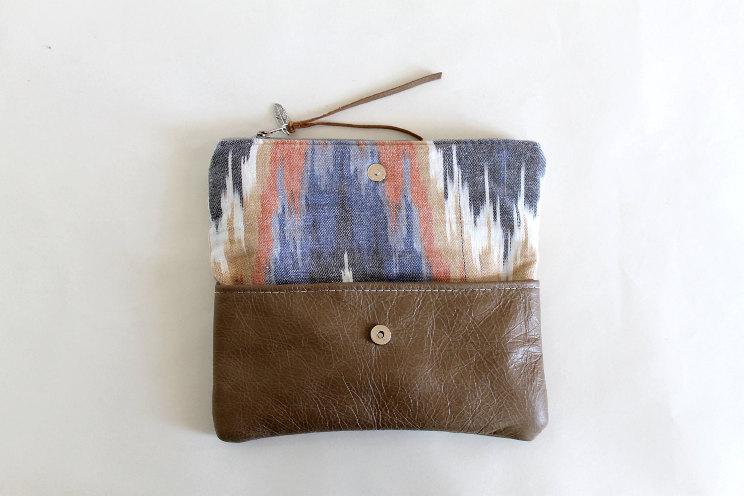 Ikat and leather fold over clutch