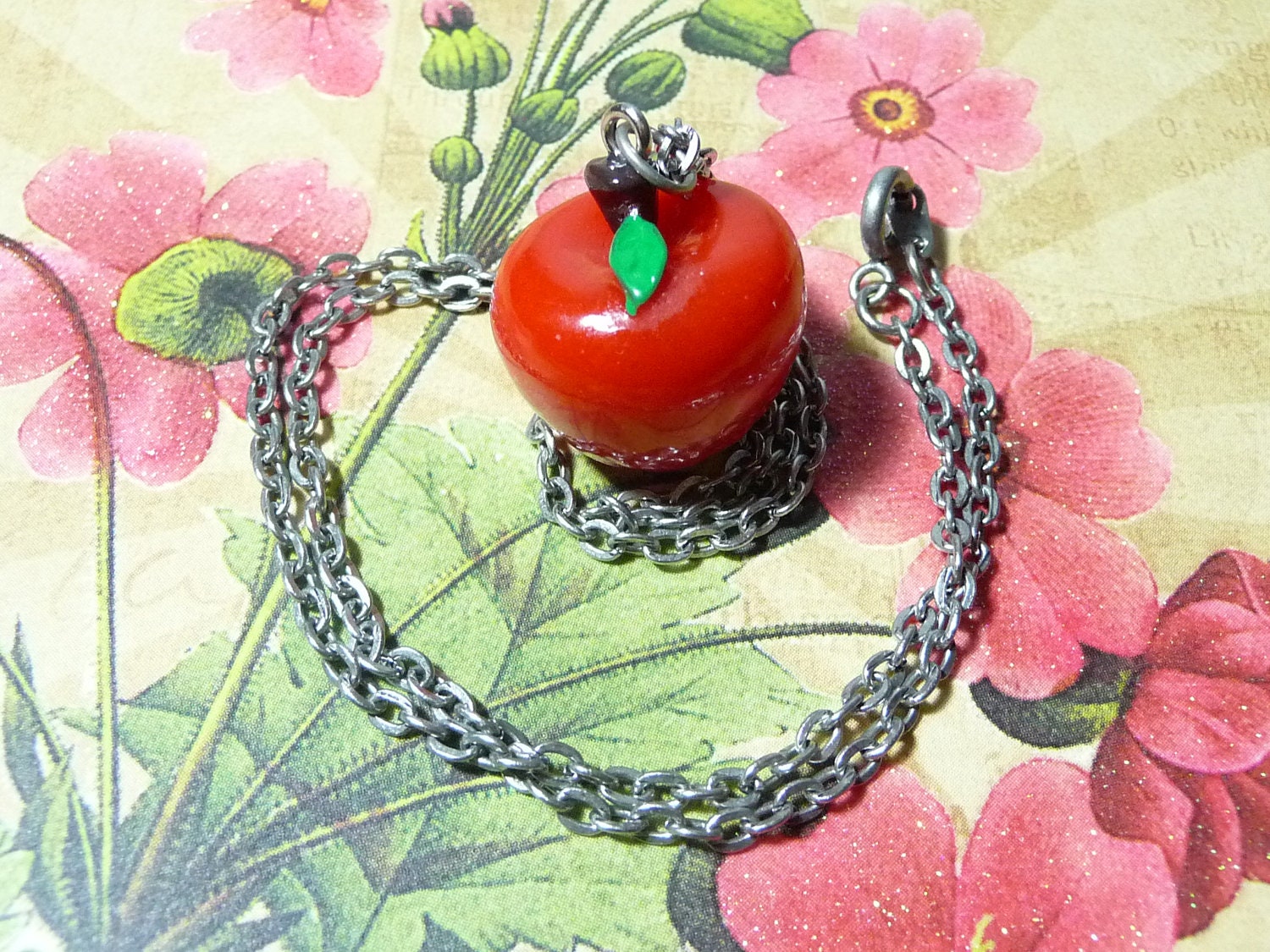 Snow White's Bitten Apple necklace by vintagerust