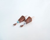 Copper etched shield drop earrings with blue glass bead