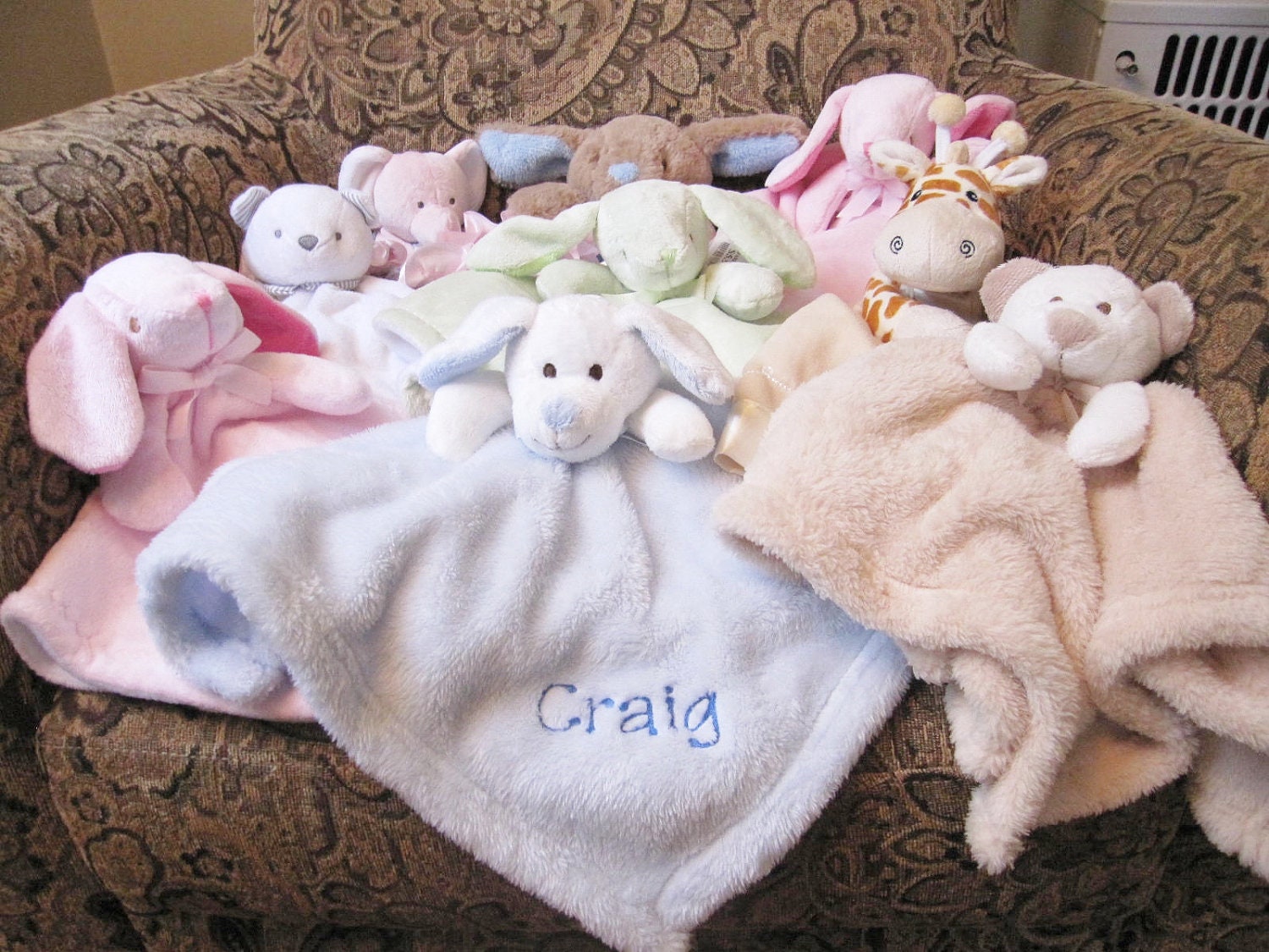 blankets with stuffed animals attached