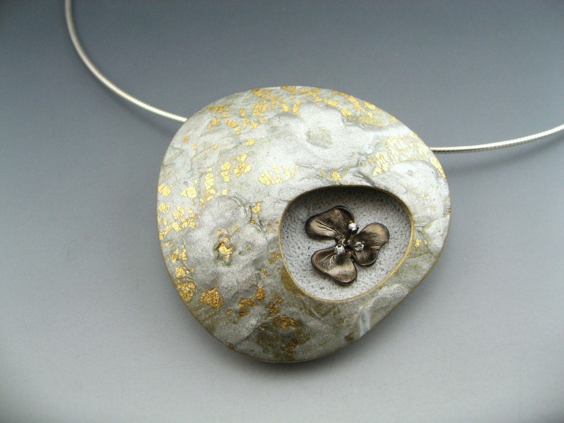 Contemporary polymer clay statement pendant necklace in gold and silver lace finish with bronze flower and cubic zirconia detail