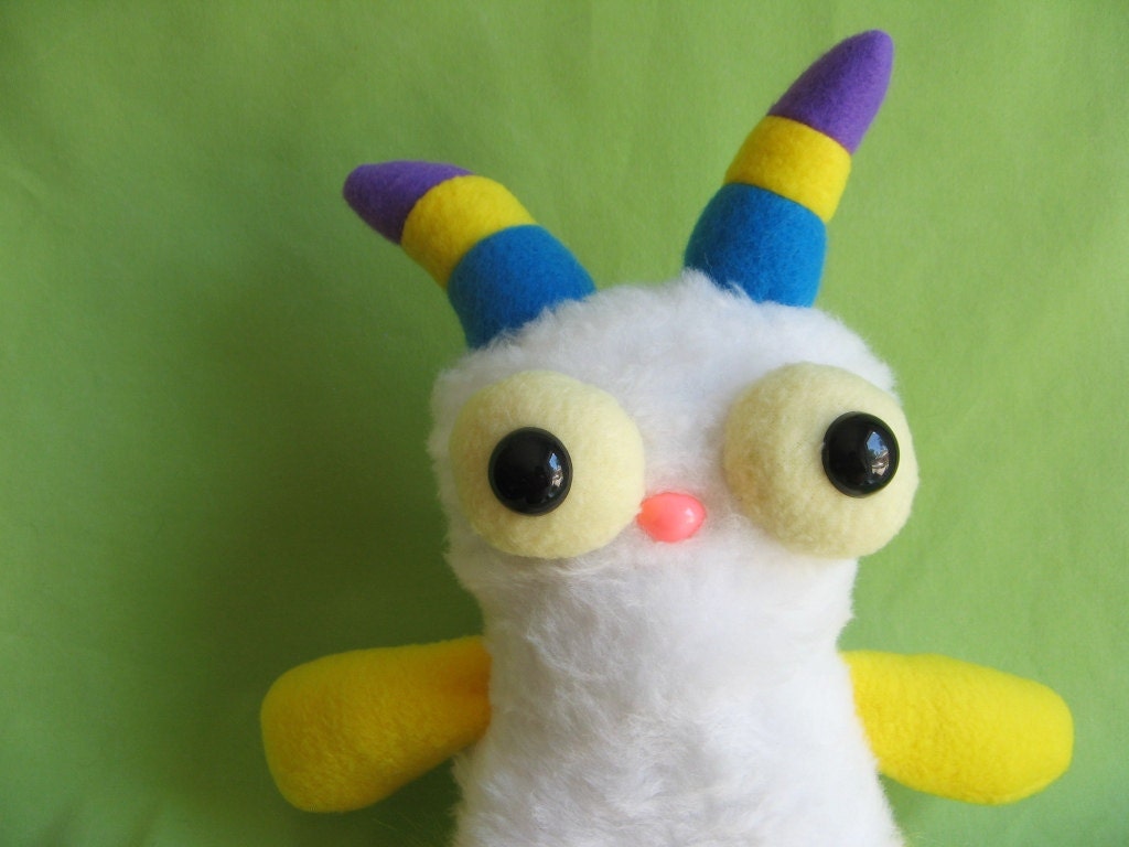Monster toy stuffed animal plush with striped horns