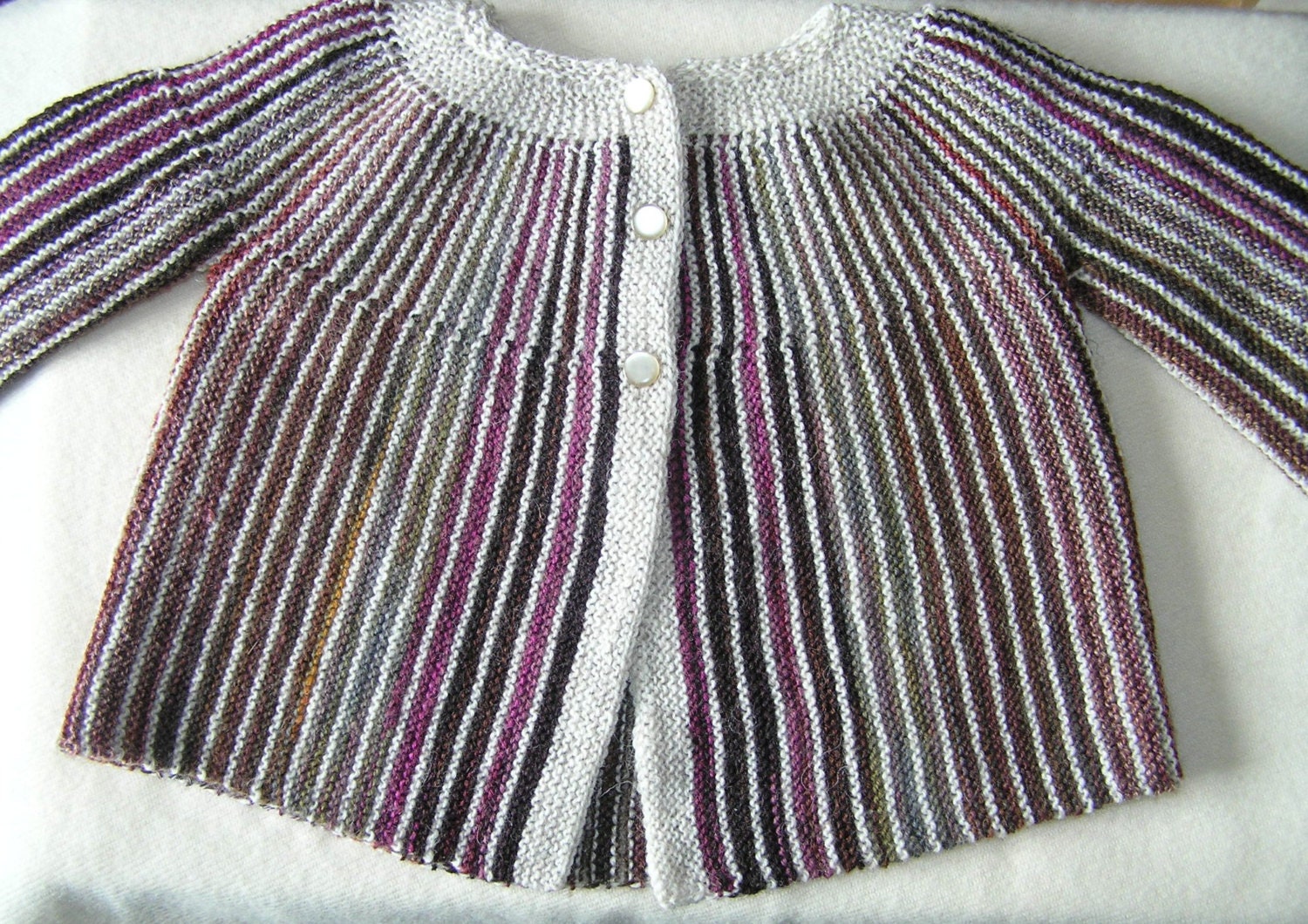 Handknitted striped baby jacket