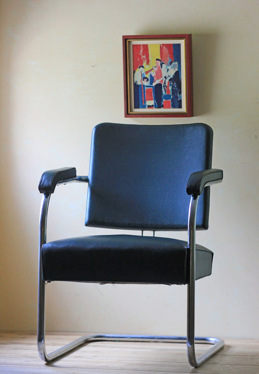 dark green vinyl and metal office chair