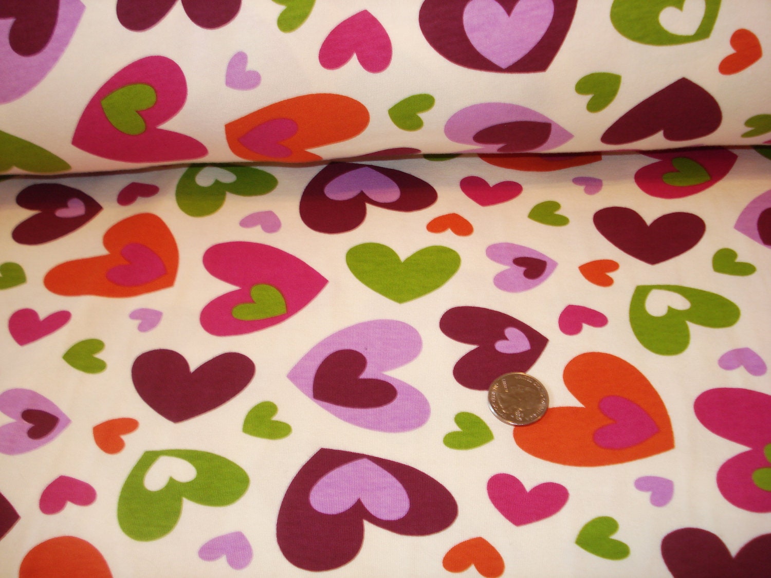 Falling hearts on off white Cotton Lycra knit fabric 1 YD
