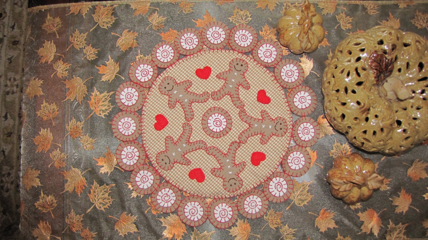 Gingerbread man Penny Rug with hearts and candy swirls, Candle Mat, Table Mat, brown, white, red and tan checked wool flannel