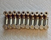 Bullet shell casing pendants, Lot of 30 Nickel Silver brass .40 caliber Casings, 10 Pre-drilled for your jewelry needs.....Lot 502
