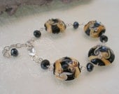 Bracelet of Glass Lentil Beads with Swarovski Crystal -Black and Tan