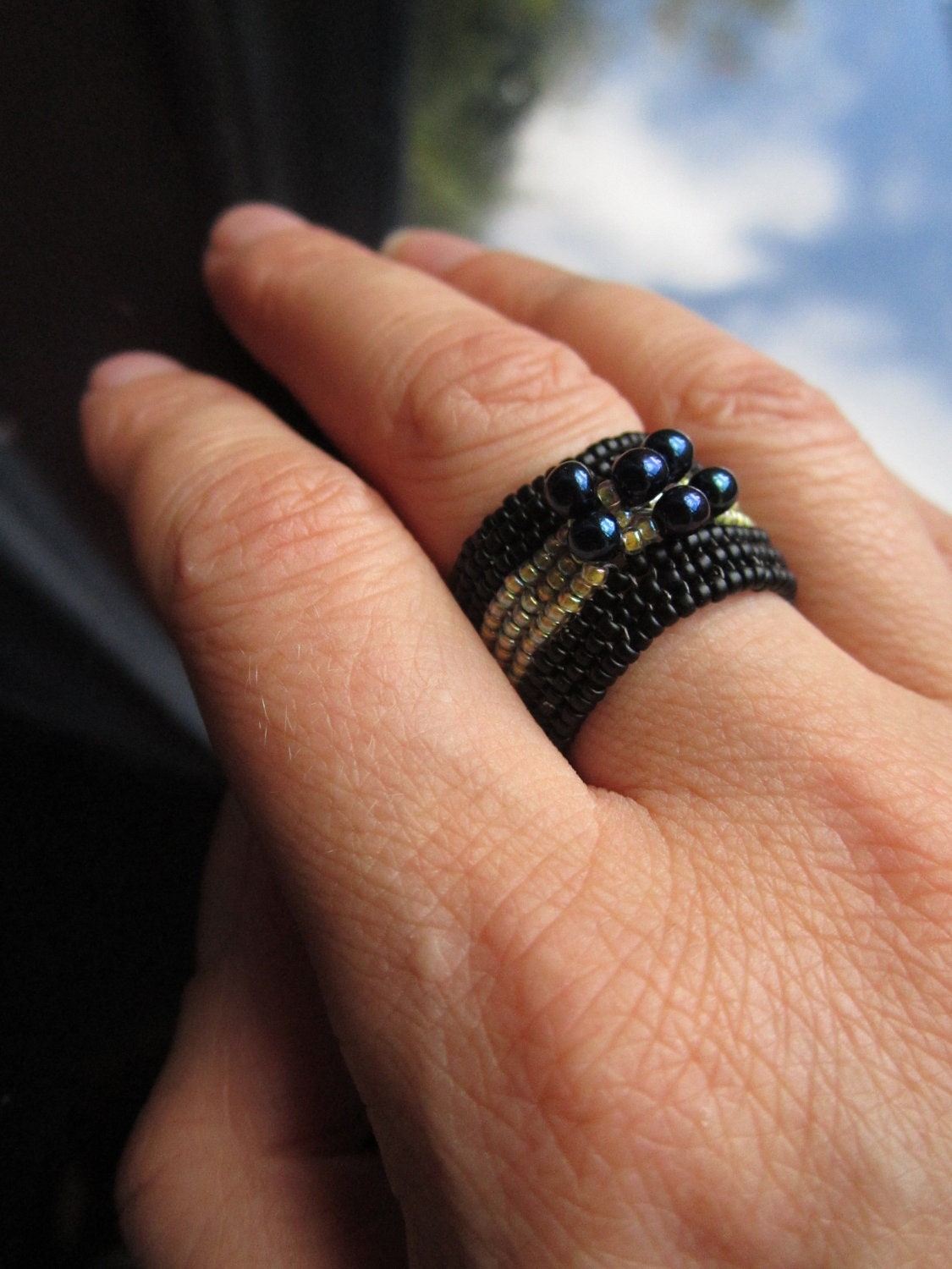 Black and yellow beaded ring made with miyuki drop seed beads