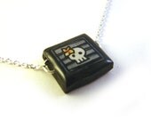 Tiny Grey Skull Necklace