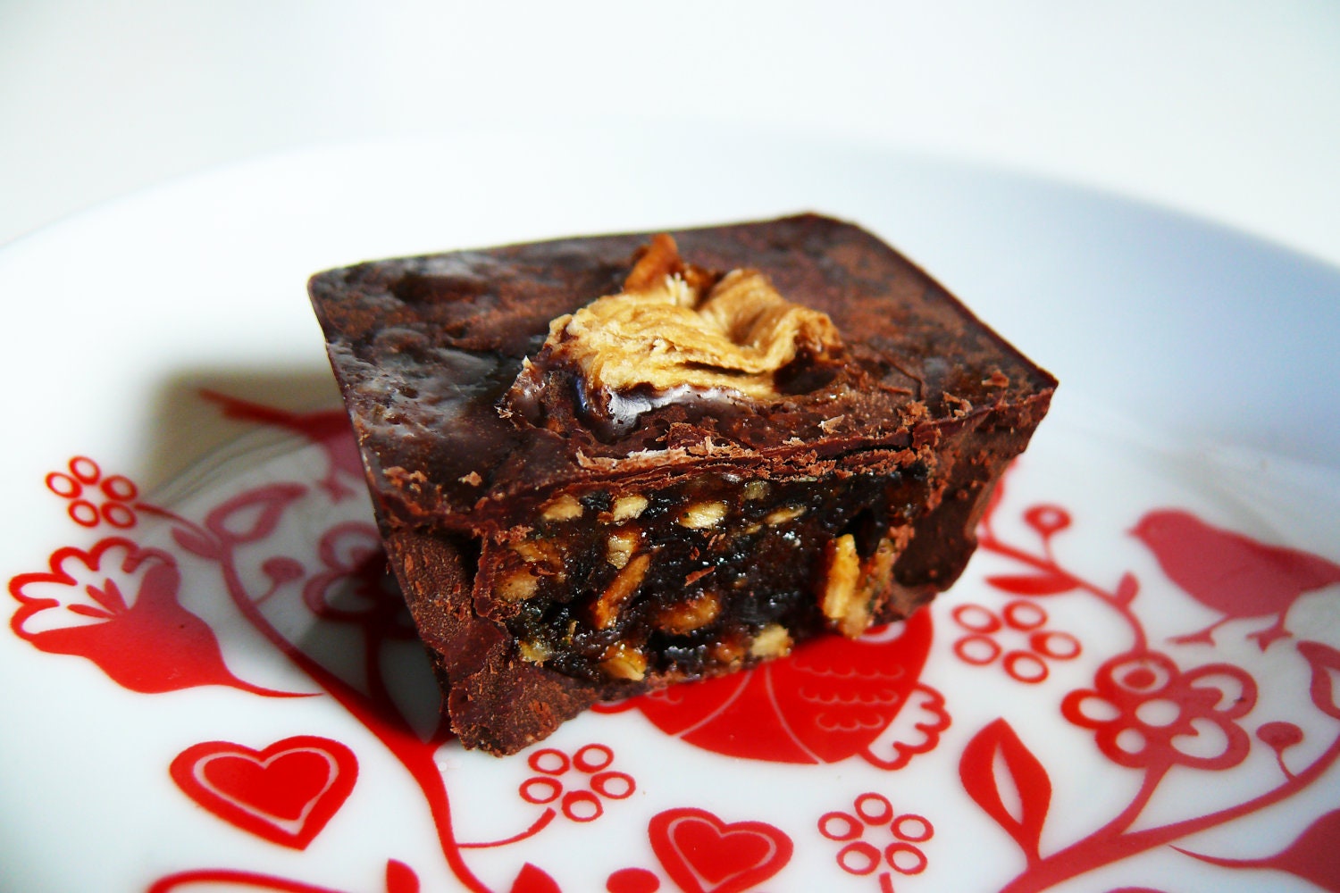 A box of 9 raw dark chocolates with pineapple and mint. Vegan, organic, sugar free, gluten free and nut free