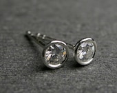 Bezel set Moissanite and sterling silver stud earrings 4mm