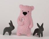 A pink  felt bear brooch