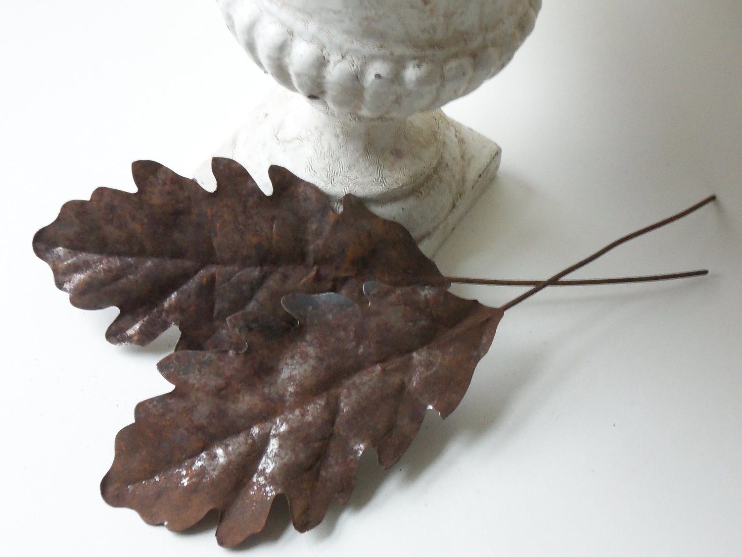 two vintage rusty tin leaves