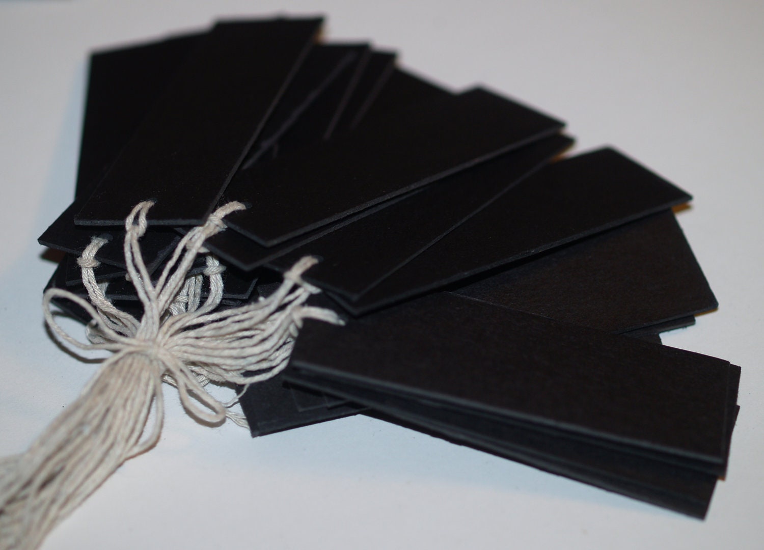 Black Label ... 25 Tags . Jet Black . Chipboard . Natural Twine Ties . Basic . Heavy Duty . Rustic . Sturdy . Thick . Cardstock